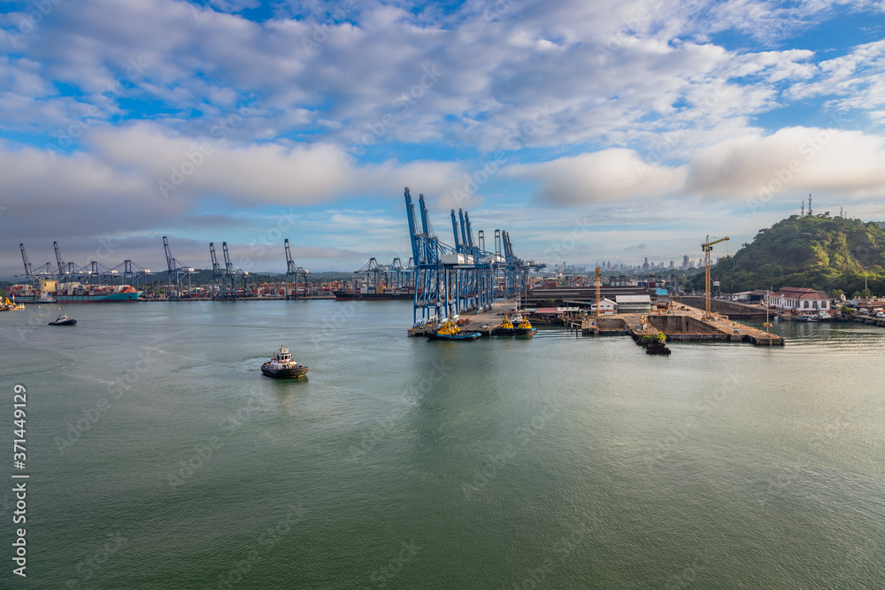 Colon Container Terminal (CCT) in Panama. View of the industrial Colon Container Terminal (CCT), Panama. This is used for import, export, logistic and transportation, Container ship loading and unload