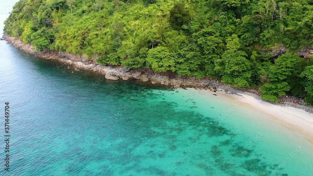 Green island with sea beach from aerial view. Tropical nature with hidden beach and turquoise sea water at Krabi islands, Thailand