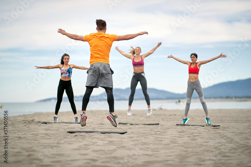 Group of people exercising together; Healthy lifestyle concept