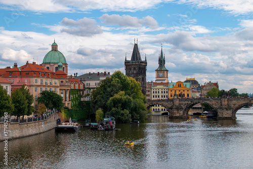 View of Charles Bridge, the Old Town Bridge Tower and the Basilica of St. Francis of Assisi. Prague, Czech Republic