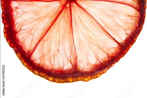 Orange lemon citrus slice with pink color macro pattern isolated on white background for wallpaper