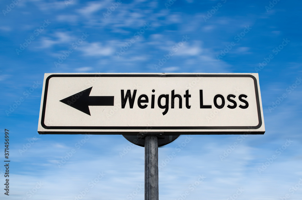 Weight Loss road sign, arrow on blue sky background. One way blank road sign with copy space. Arrow on a pole pointing in one direction. Weight Loss road sign, arrow on blue sky background. One way blank road sign with copy space. Arrow on a pole pointing in one direction.