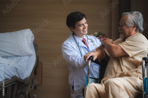 Doctor talking to elderly patient man at the hospital  senior patient man