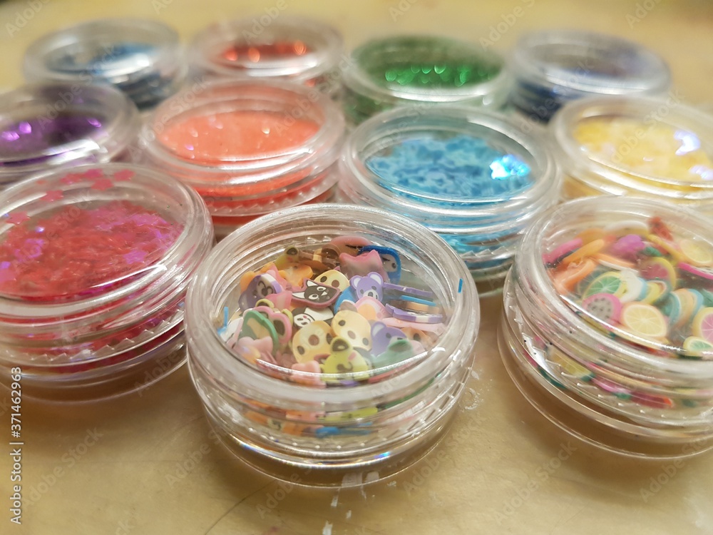Festive colorful sequins in jars Festive colorful sequins in jars