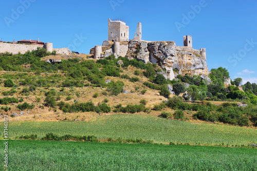 View of castle and sunflower fields in Calatañazor, town of Castilla, Spain,