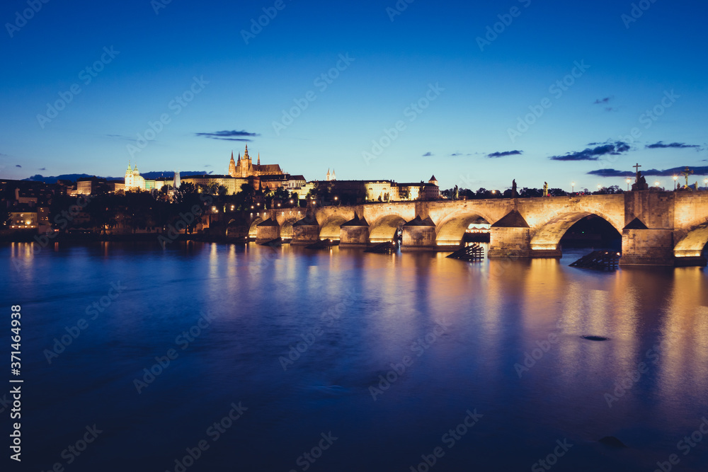 Charles Bridge over River Vltava in Prague at Night and  St Vitus Cathedral