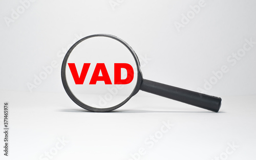 VAD in a magnifying glass on an endless white background