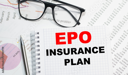 EPO Insurance Plan on a table against the background of financial statements, next to a calculator and a pen.