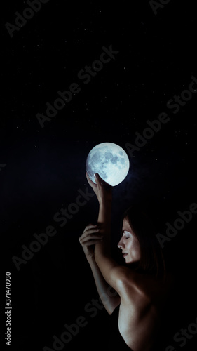 portrait of sensual woman under moon © allasimacheva