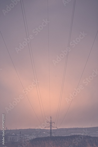 high voltage power line in sunset