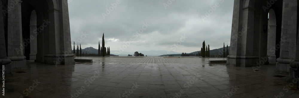 Architecture and design. Panorama view of the empty esplanade and abbey made of concrete blocks in the closed Valley of the Fallen, Spain, due to coronavirus pandemic.
