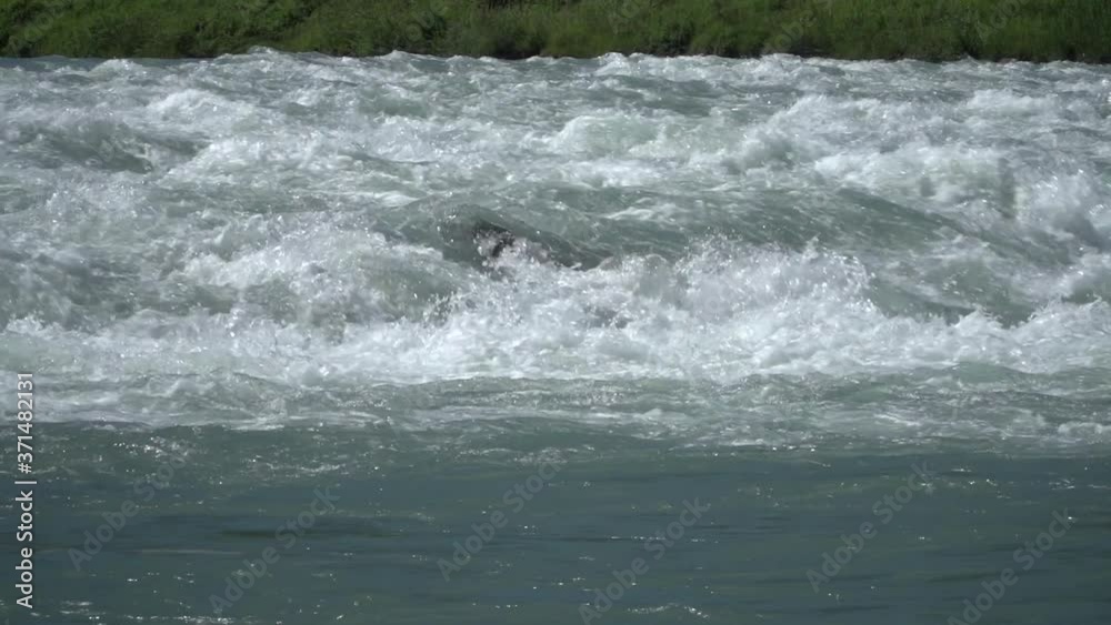 Cascades of the young Alpine Rhine river in the Principality of Liechtenstein in the European Alps. Slow motion footage shot at a high frame rate. Cascades of the young Alpine Rhine river in the Principality of Liechtenstein in the European Alps. Slow motion footage shot at a high frame rate.