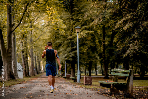 Young Caucasian man jogging in the park
