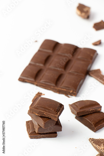 chocolate pieces on white background