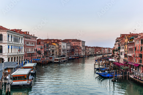 View of the  Canal Grande its palaces, and the water ferry station of Rialto in Venice at sunrise from the Rialto Bridge © gdefilip