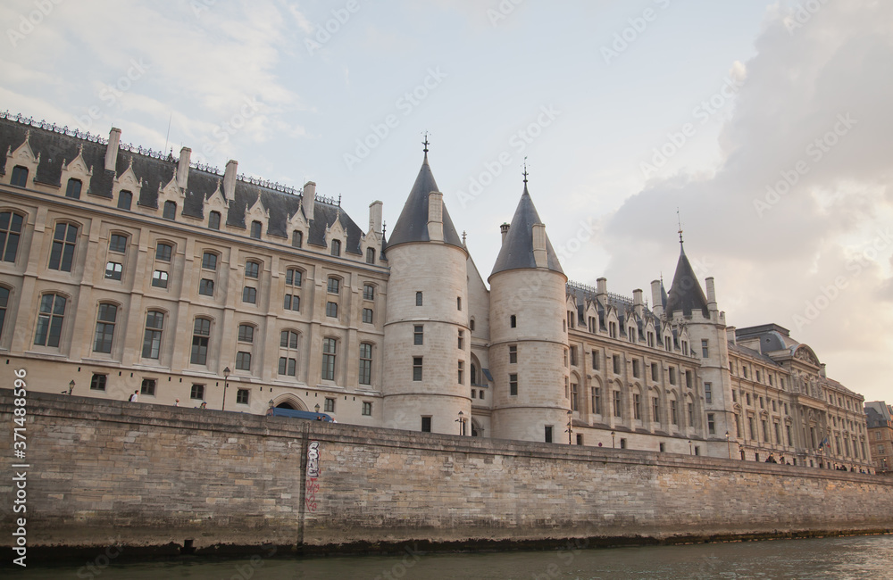 Palais de Justice standing on the banks of river Seine on the Ile de la Cite, Paris - France.