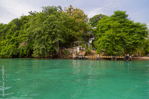 Capurgana, Choco, Colombia. September 19, 2019: View of beautiful Island with green sea photo