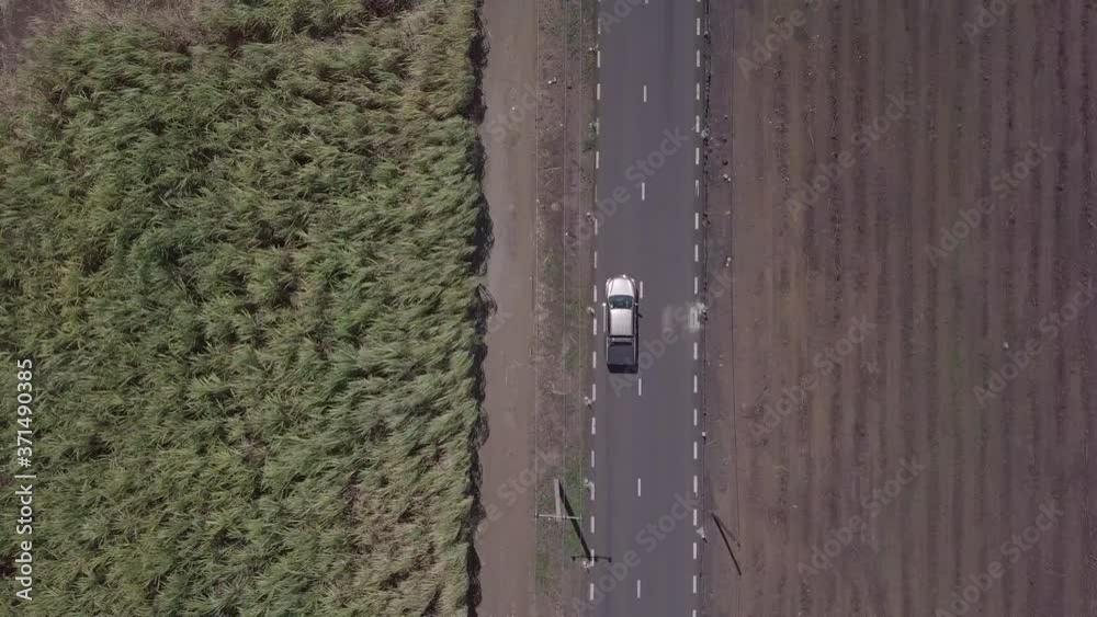 drone shot that follow a car on a road drone shot that follow a car on a road