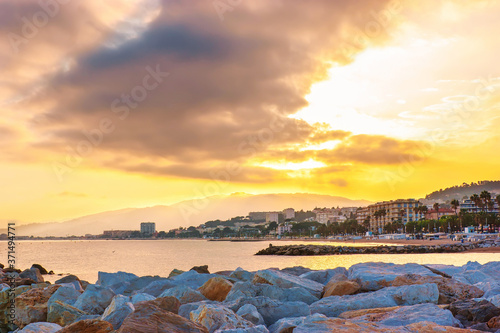 The golden sunset over the coastline of Cannes, France