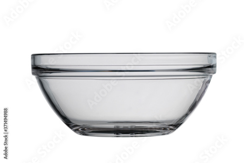 Empty glass salad bowl, round shape. Isolated on a white background