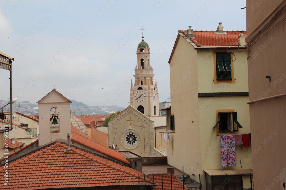 Red tiled roofs of houses and Catholic cathedrals