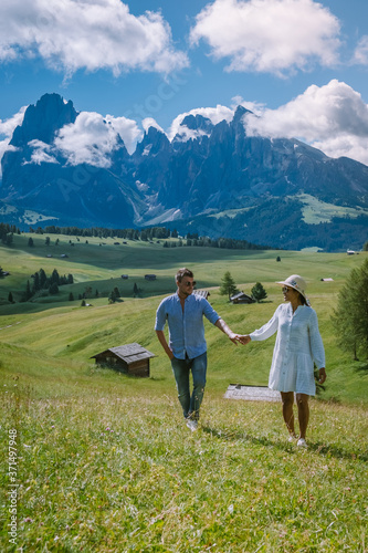 Couple on vacation Santa Magdalena Village in Dolomites area Italy, couple on vacation Val Di Funes Italian Dolomites Europe photo