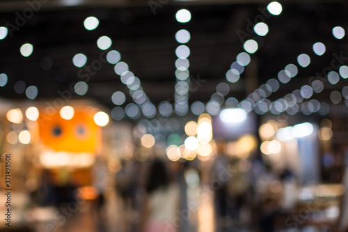 Slika na platnu Abstract people walking in exhibition blurred background
