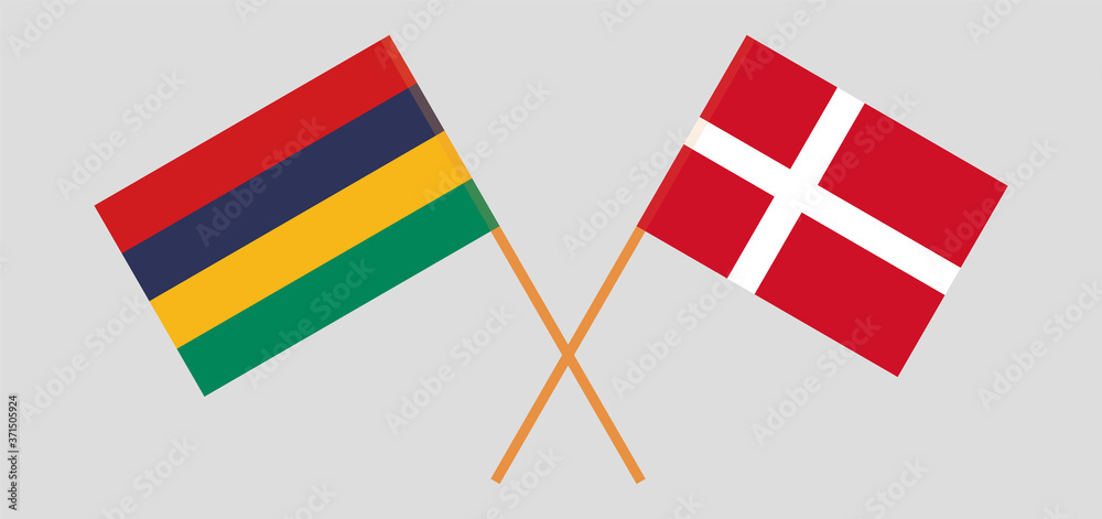 Crossed and waving flags of Mauritius and Denmark