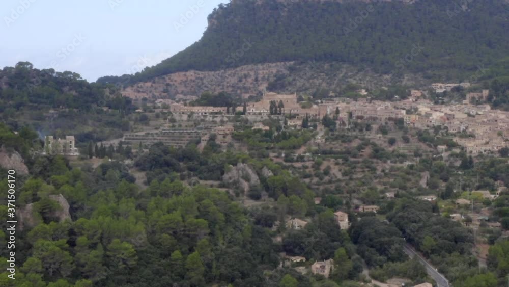 AERIAL: View on Valldemossa on Mountains in Jungle Forest on Tropical Island Mallorca, Spain on Sunny Day Vacation, Travel, Sunny AERIAL: View on Valldemossa on Mountains in Jungle Forest on Tropical Island Mallorca, Spain on Sunny Day Vacation, Travel, Sunny
