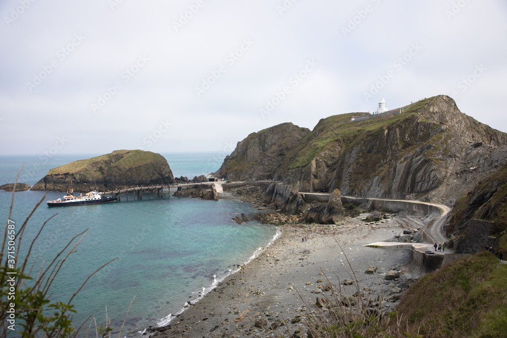Fototapeta premium Views of the southern end of Lundy Island with a misty sky, The Bristol Channel, Devon, UK