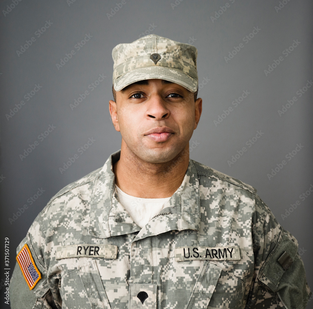 Close up of mixed race soldier smiling Close up of mixed race soldier smiling