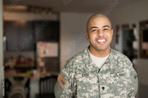 Mixed race man smiling in living room