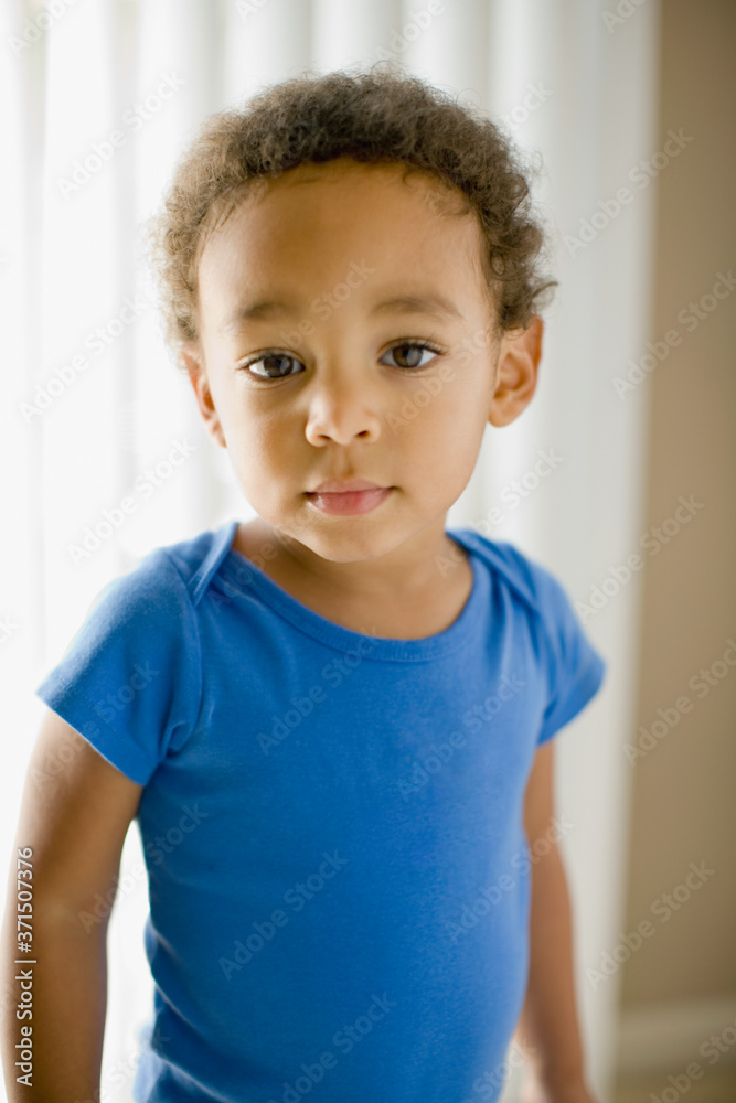 Serious mixed race young boy Serious mixed race young boy