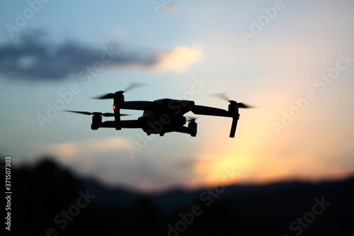 Close up picture of drone in the sky at sunset