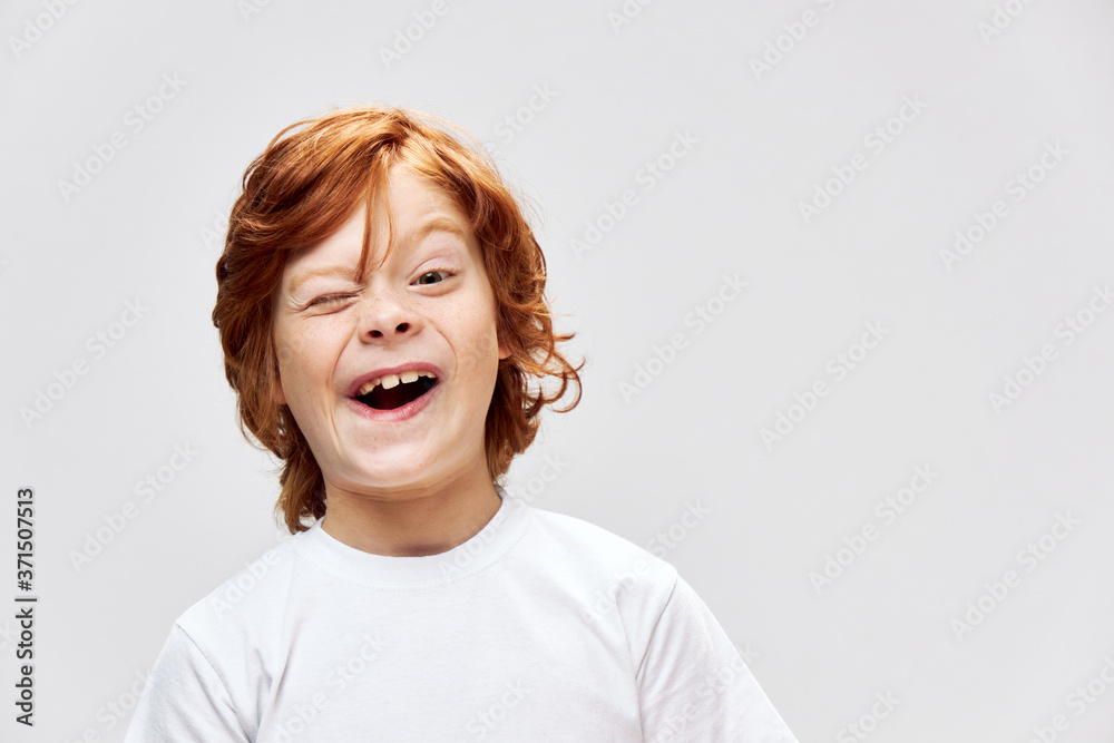funny redhead boy with open mouth grimace cropped white t-shirt studio funny redhead boy with open mouth grimace cropped white t-shirt studio