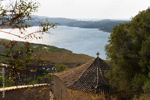 View from the Venetian fortress of Vonitsa over the little Byzantine church of Agia Sofia, Limeni Lagoon and the Ambracian Gulf, Greece photo