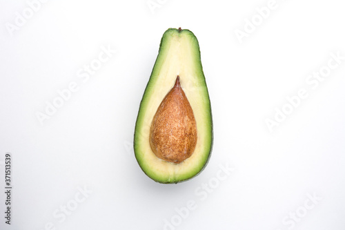 Half Avocado on a white background top view.