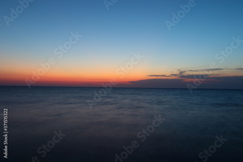 sunset over the sea © yagizkengil