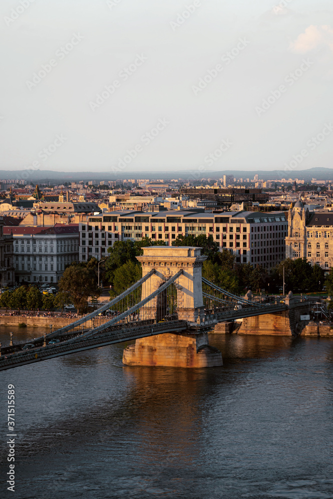 bridge old and beautiful in europe city in river in sunset good light with city 