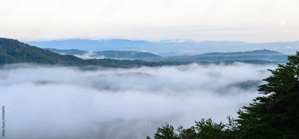 fog in the valley below a scenic overlook along the skyway motorway in the talladega national forest, alabama, usa fog in the valley below a scenic overlook along the skyway motorway in the talladega national forest, alabama, usa