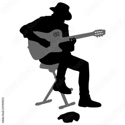 Silhouette musician plays the guitar on a white background