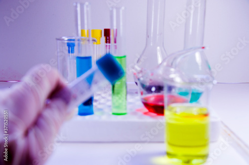 Chemical laboratory instruments, glassware and pipette. Tests and research diagnoses.