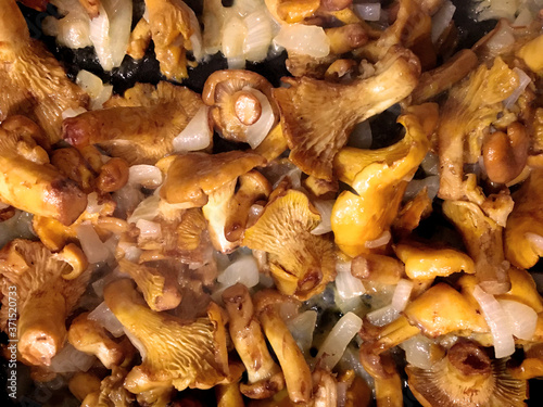 fried chanterelle mushrooms with vegetable oil and onions.