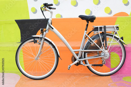 electric bicycle on the colourful background, e-bike, city bike