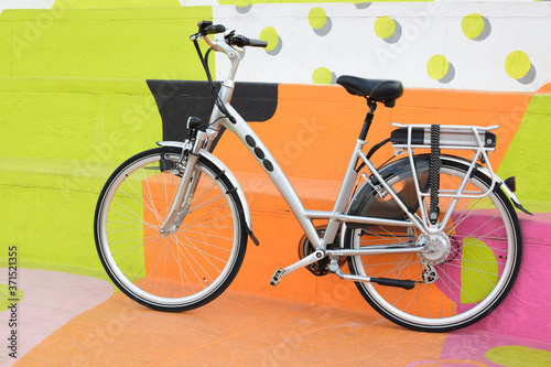 electric bicycle on the colourful background, e-bike, city bike