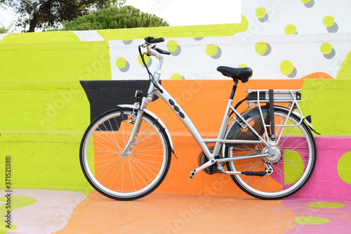 electric bicycle on the colourful background, e-bike, city bike