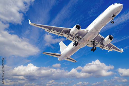 modern airliner takes off into a blue sky