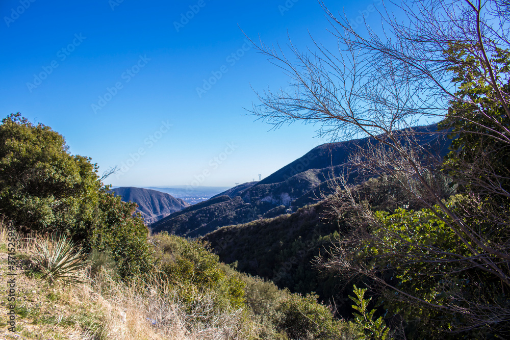 Peekaboo Views of the San Gabriel Valley through the Mountains of the Angeles National Forest outside of Los Angeles, California, USA Peekaboo Views of the San Gabriel Valley through the Mountains of the Angeles National Forest outside of Los Angeles, California, USA