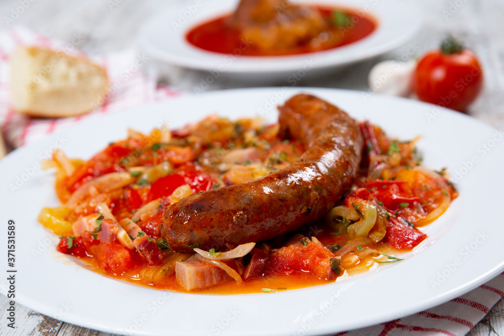 Fototapeta premium Sausage with vegetables on a plate