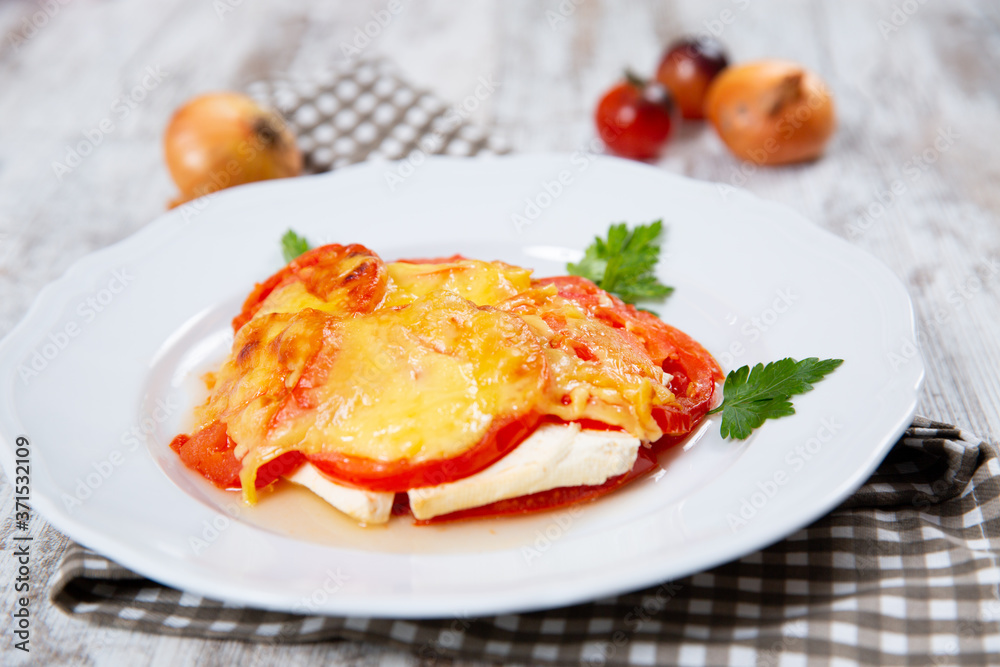 Sliced tomatoes and cheese and baked